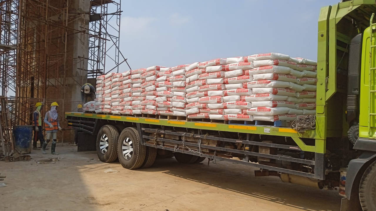 Pengiriman material Acian Mortindo M220
